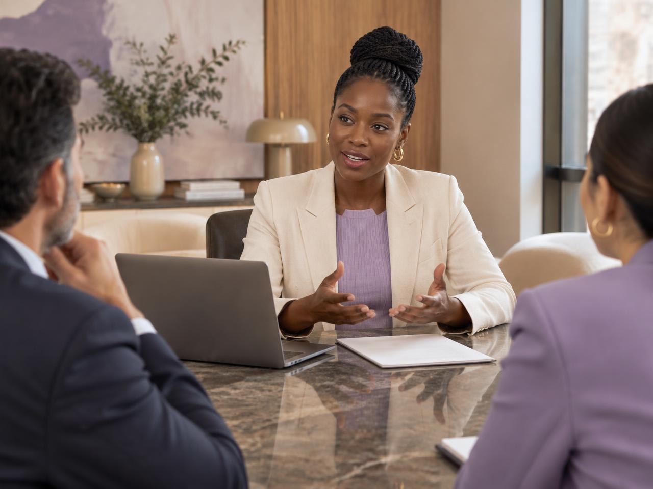 An African startup founder presenting to investors in a boardroom